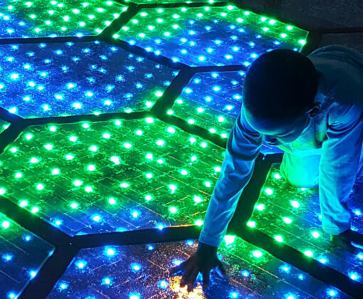 Episode 4 Solar Roadways - young boy playing on solar lit roadway