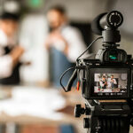 digital camera filming marketing meeting