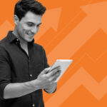 man on tablet on orange background