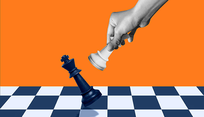 hand playing chess checkmate