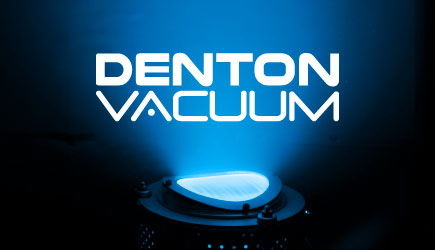 Denton Vacuum logo with light from a machine