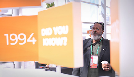 man viewing the interactive display at the conference
